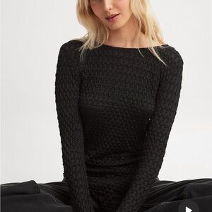 NA-KD Fashion high-sleeve top.